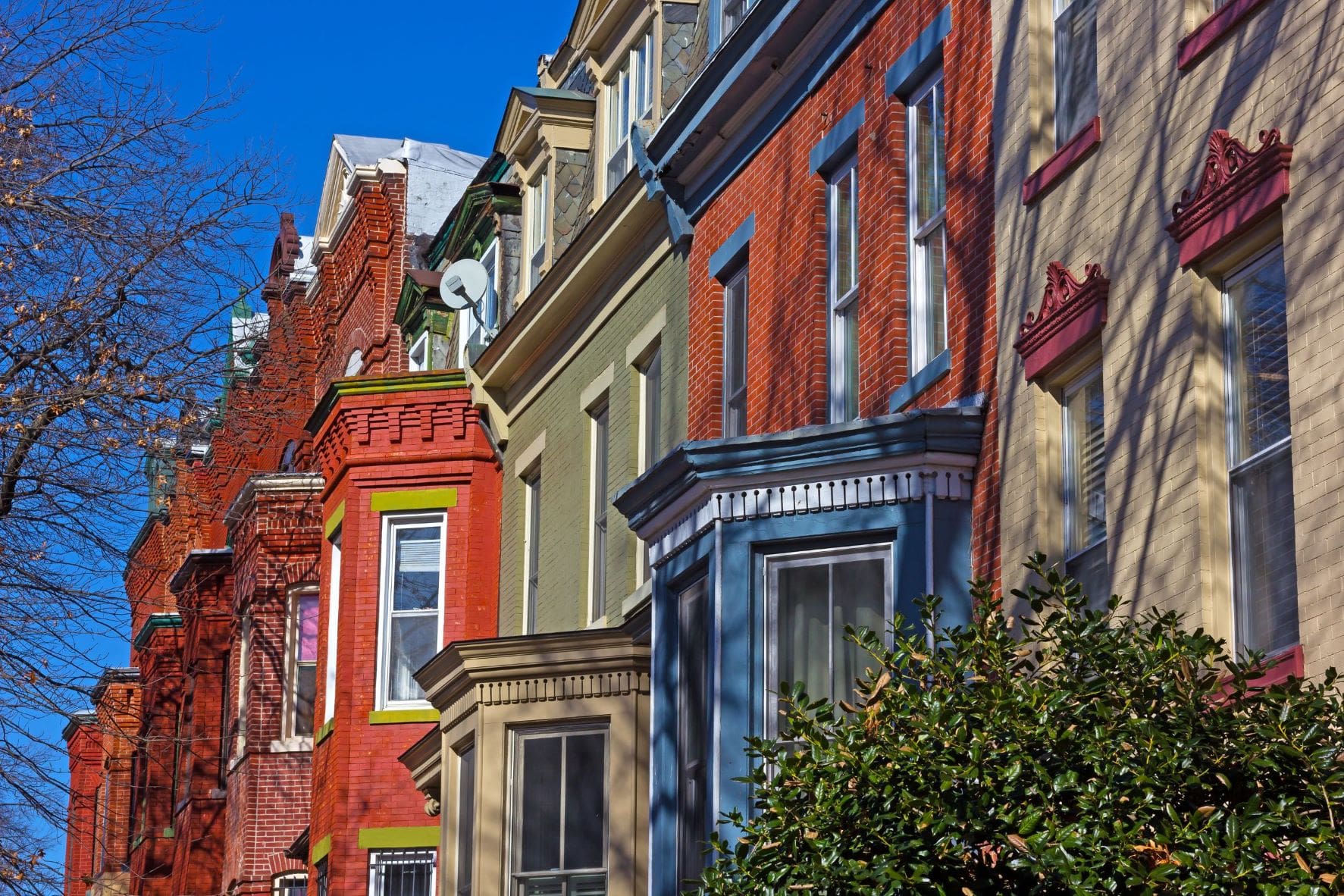Colorful rowhouses viewed from below