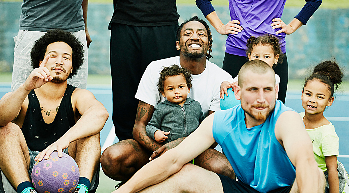 Dodgeball teammates and families posing for portrait after game
