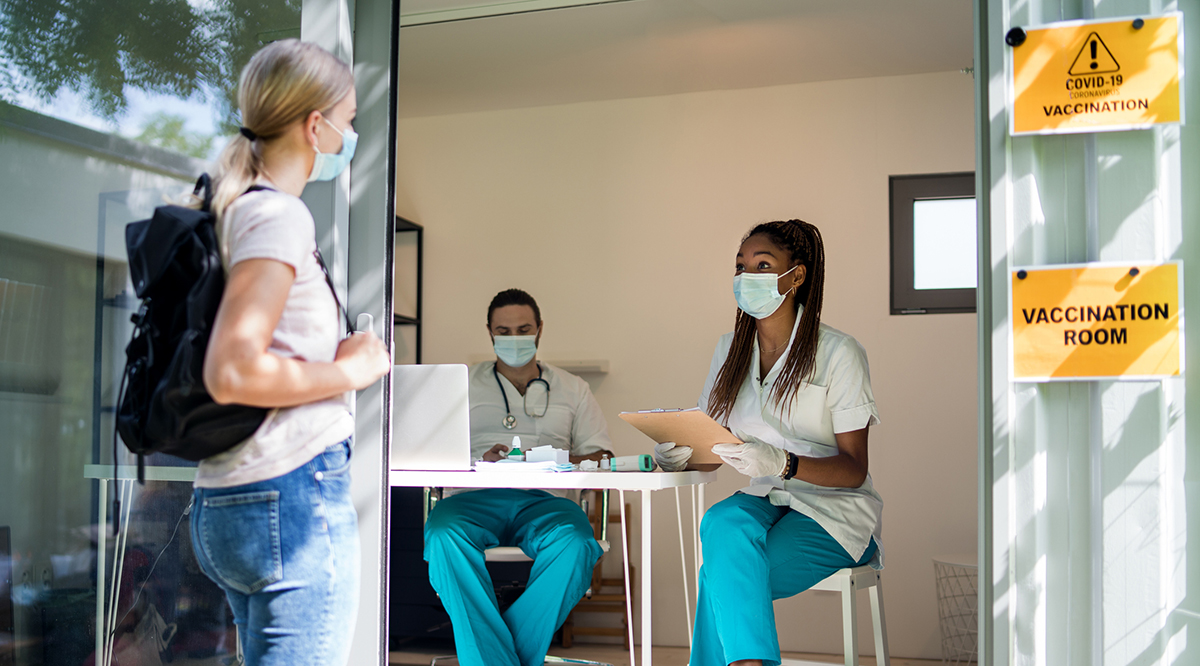 Young woman getting vaccinated, coronavirus