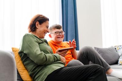 Little boy with down syndrome enjoys spending time with his mother