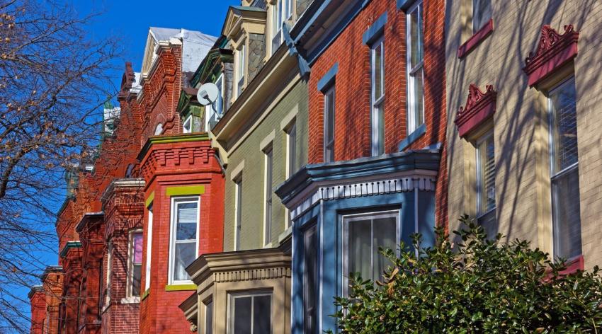 Colorful rowhouses viewed from below