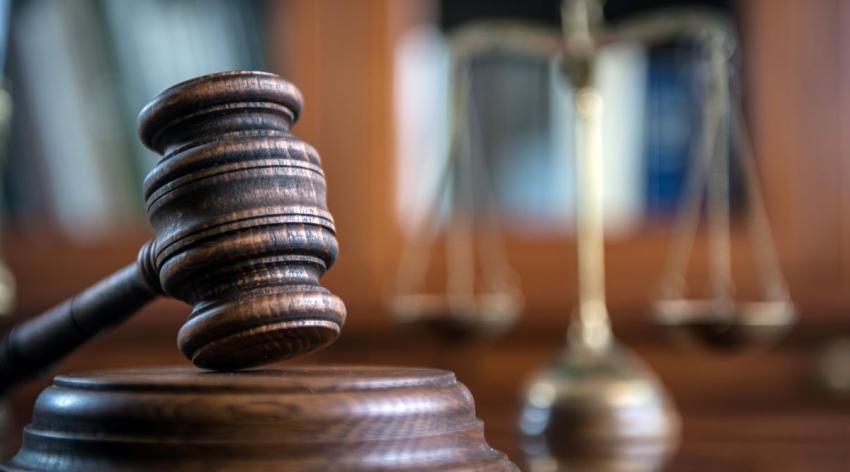 A court mallet and scales of justice